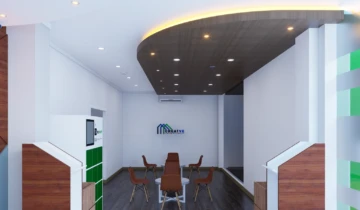 Peremajaan ruang tunggu lounge kantor modern dengan aplikasi plafon drop ceiling gypsum lengkung bermotif kayu dan flooring vinyl